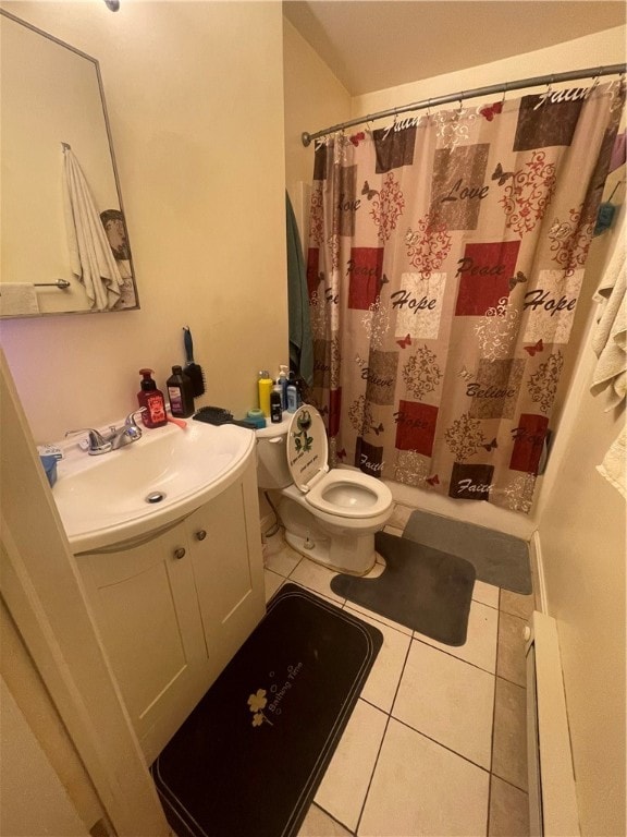 bathroom featuring tile patterned flooring, a shower with curtain, vanity, and toilet