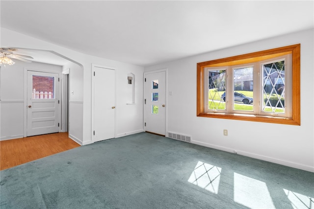 interior space featuring ceiling fan