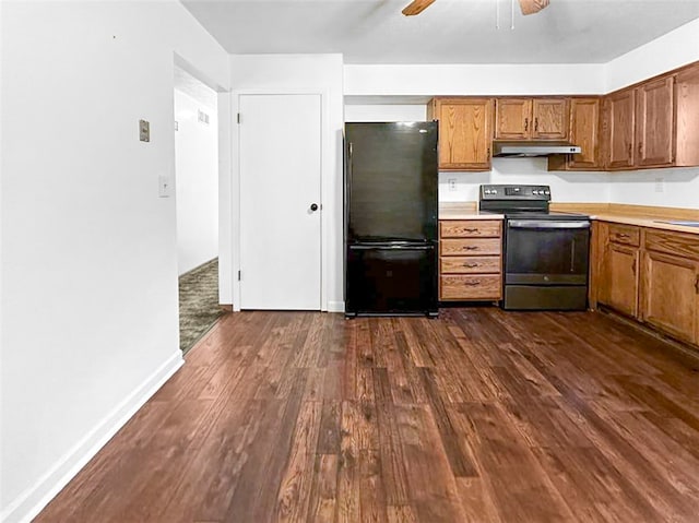 kitchen featuring black appliances, ceiling fan, and dark hardwood / wood-style flooring