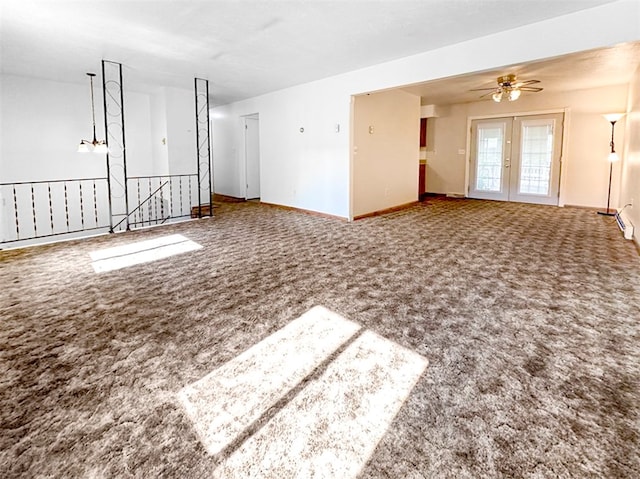 unfurnished living room featuring ceiling fan and carpet