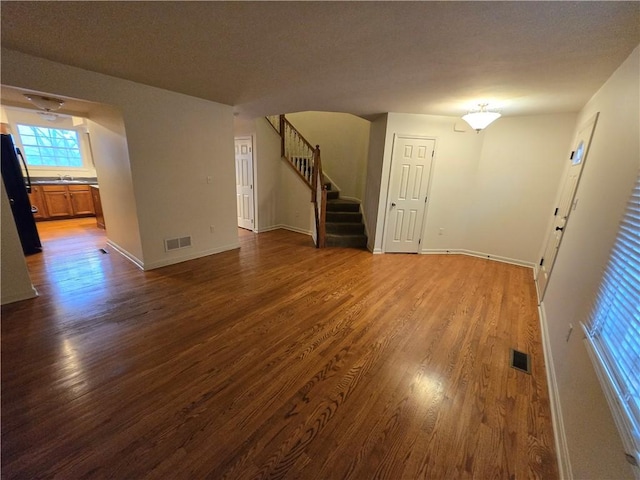 spare room with dark hardwood / wood-style flooring