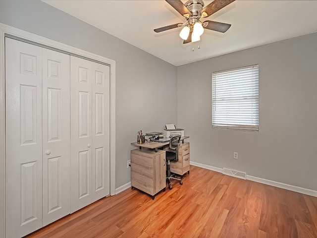 office space with light wood-type flooring and ceiling fan