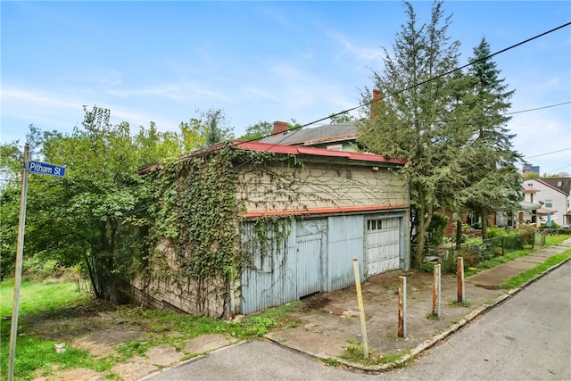 view of property exterior featuring a garage