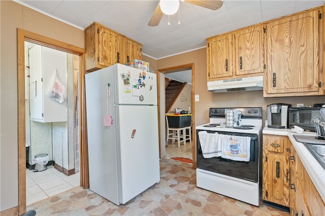 kitchen featuring ceiling fan, light tile patterned floors, ornamental molding, and white appliances