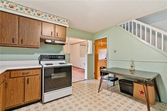 kitchen with white range with electric cooktop