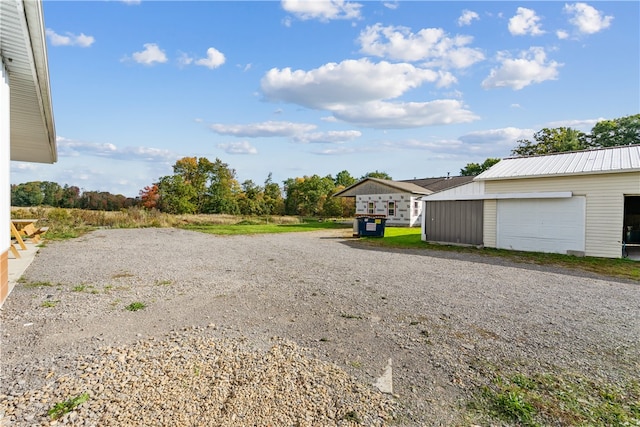 view of yard featuring an outbuilding and a garage