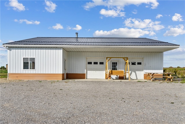 view of front of house featuring an outbuilding and a garage