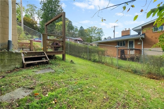 view of yard with a wooden deck