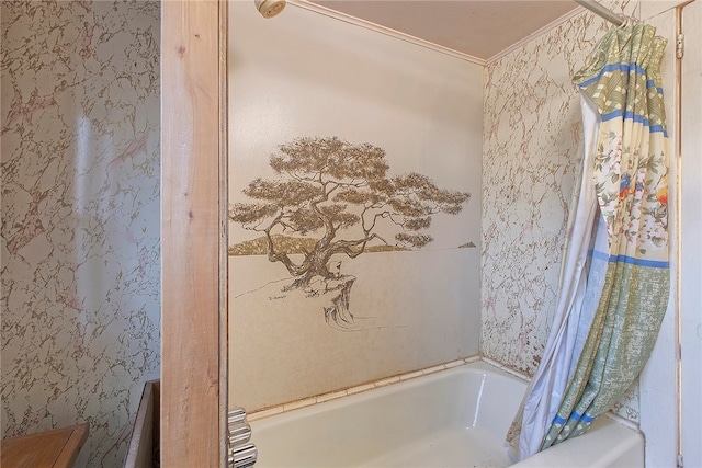 bathroom with shower / bathtub combination with curtain and crown molding