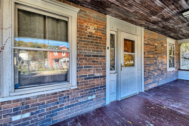 doorway to property featuring a porch