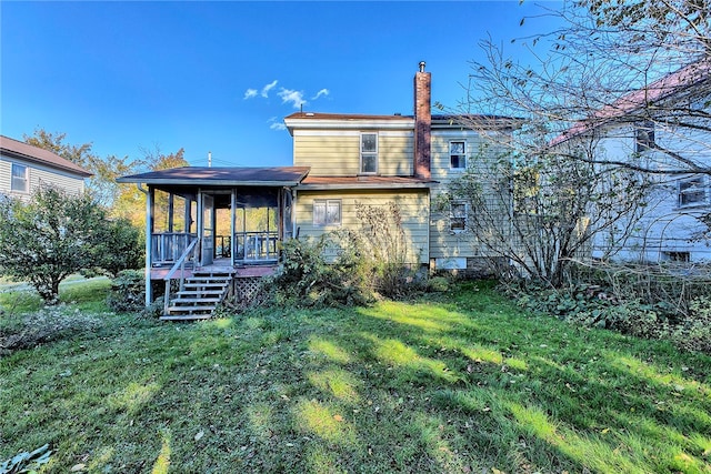 rear view of house with a lawn