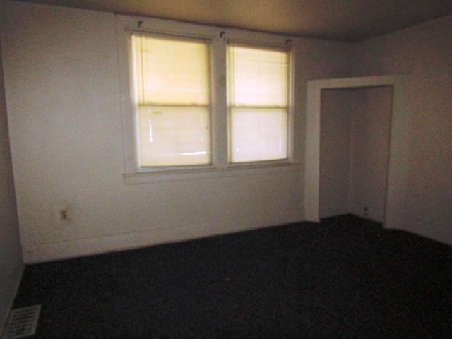spare room featuring visible vents