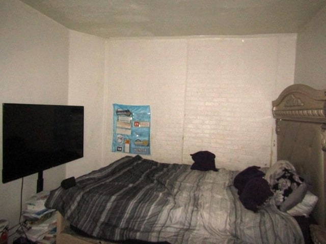 bedroom with brick wall