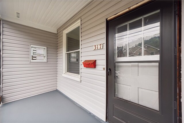 doorway to property featuring covered porch