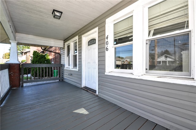 wooden terrace with a porch