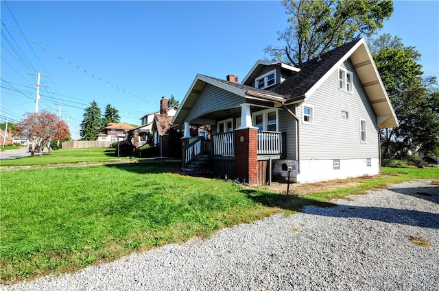 view of side of home featuring a yard