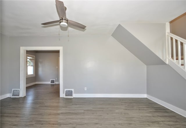 additional living space featuring ceiling fan and dark hardwood / wood-style floors