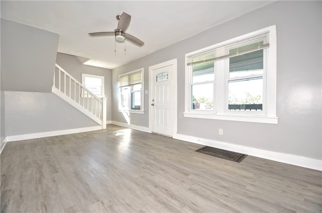 entryway with hardwood / wood-style flooring and ceiling fan