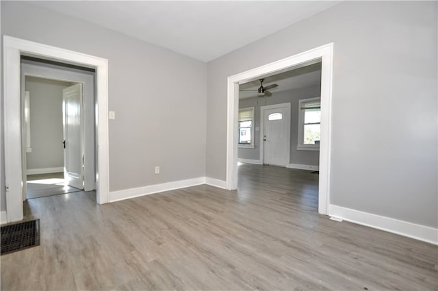 spare room with light hardwood / wood-style flooring and ceiling fan