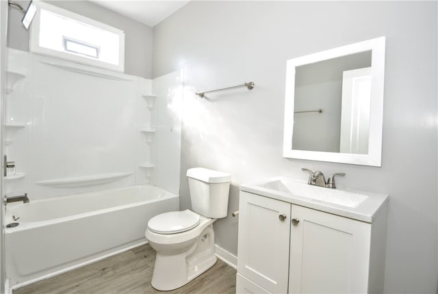 full bathroom featuring bathing tub / shower combination, vanity, toilet, and wood-type flooring