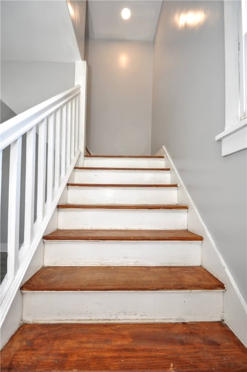 staircase featuring hardwood / wood-style floors