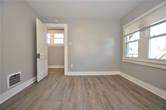 empty room with wood-type flooring