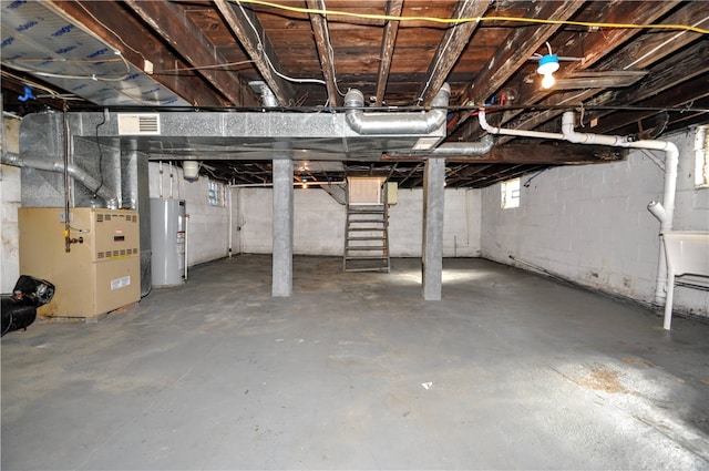 basement with water heater and heating unit