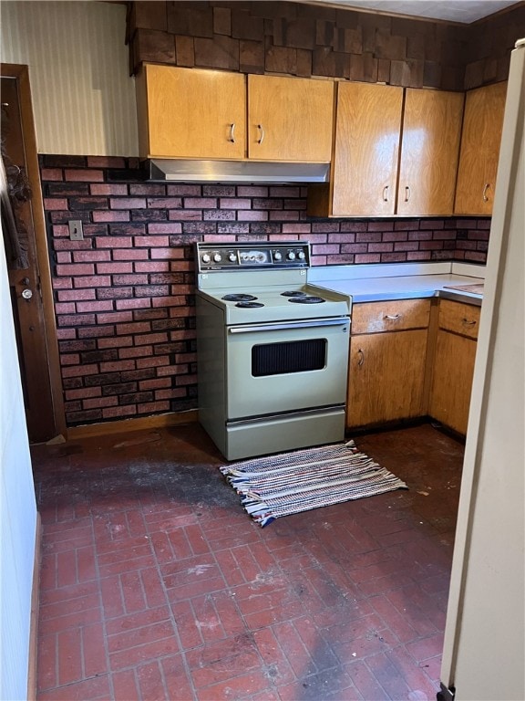 kitchen featuring tasteful backsplash and white electric range oven