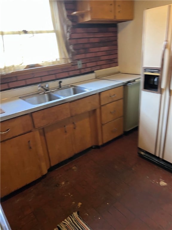 kitchen with white fridge with ice dispenser, sink, and dark hardwood / wood-style flooring