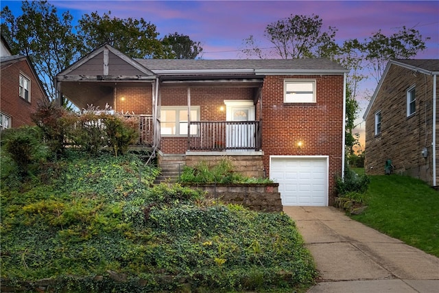 view of front of property with a garage and a porch