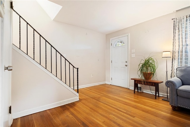 foyer entrance with hardwood / wood-style floors