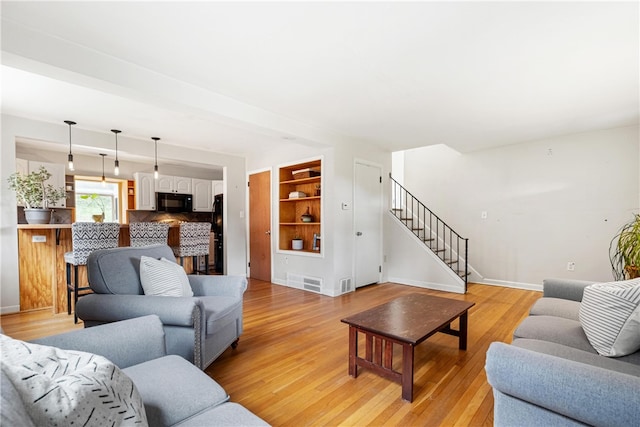 living room featuring light wood-type flooring