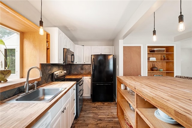 kitchen featuring pendant lighting, white cabinets, sink, and stainless steel appliances