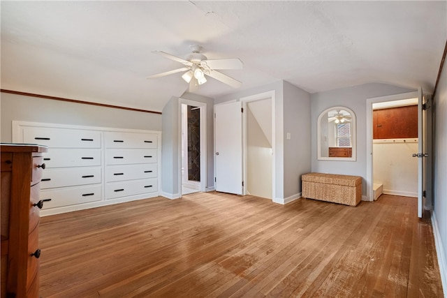 bonus room with light wood-type flooring and ceiling fan