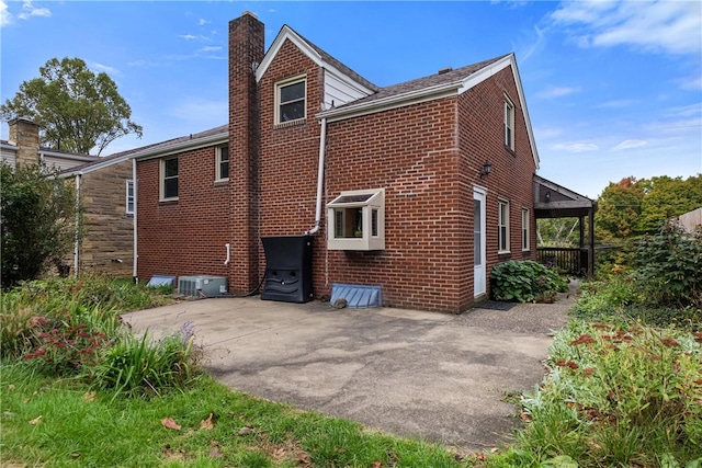 view of property exterior featuring a patio area