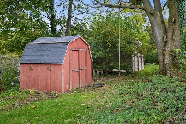 view of outdoor structure with a lawn