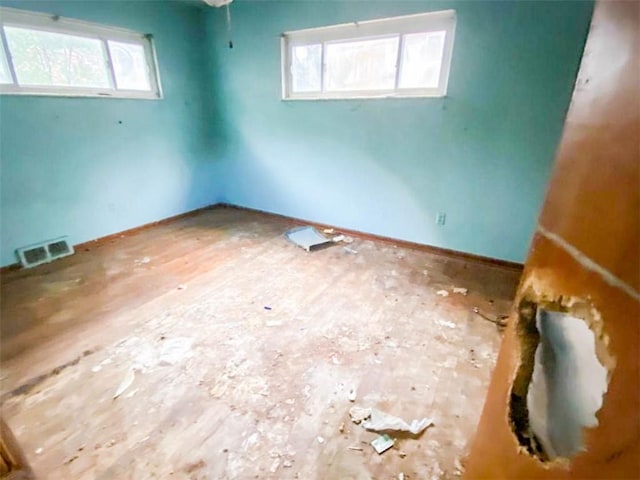spare room featuring visible vents