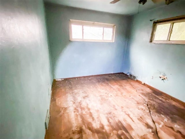 spare room featuring visible vents and a ceiling fan
