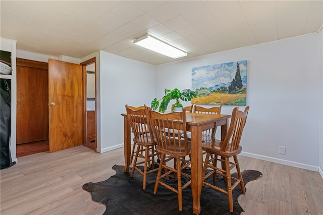 dining area with light wood-type flooring