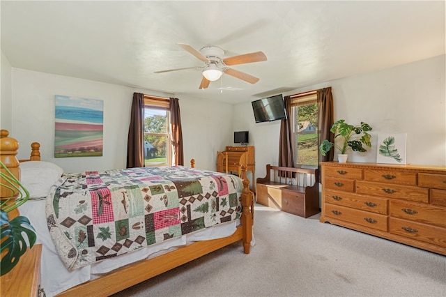 carpeted bedroom featuring ceiling fan