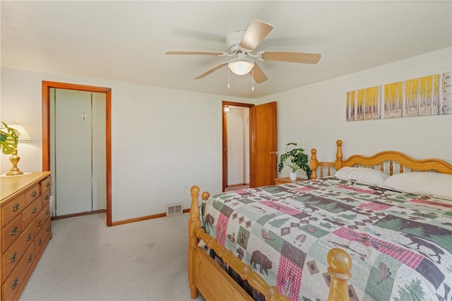 bedroom featuring ceiling fan and light carpet