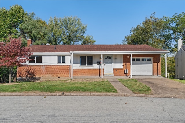 ranch-style house with covered porch and a garage