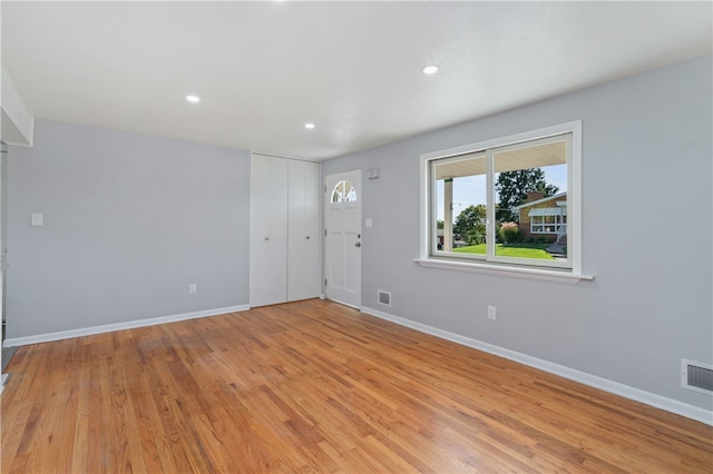 spare room featuring light hardwood / wood-style floors