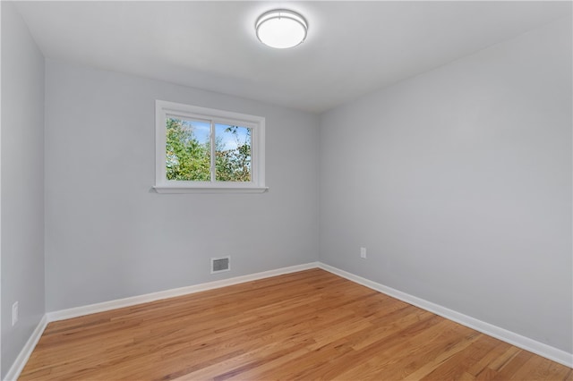 spare room with light hardwood / wood-style flooring