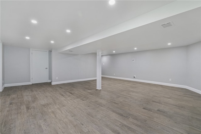 basement featuring hardwood / wood-style floors