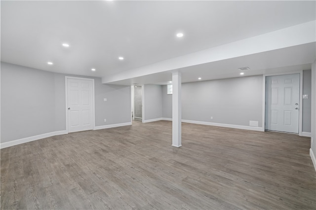 basement featuring wood-type flooring