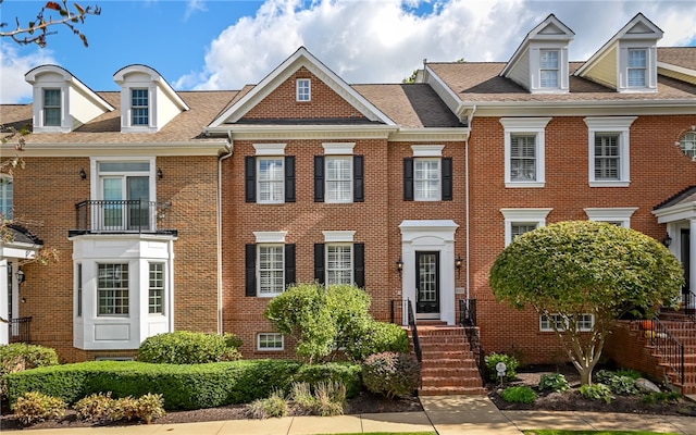 view of front of home with a balcony