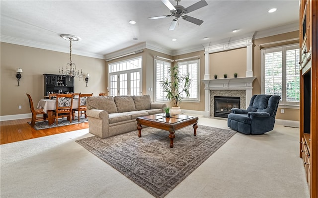 living room featuring plenty of natural light, crown molding, and hardwood / wood-style flooring