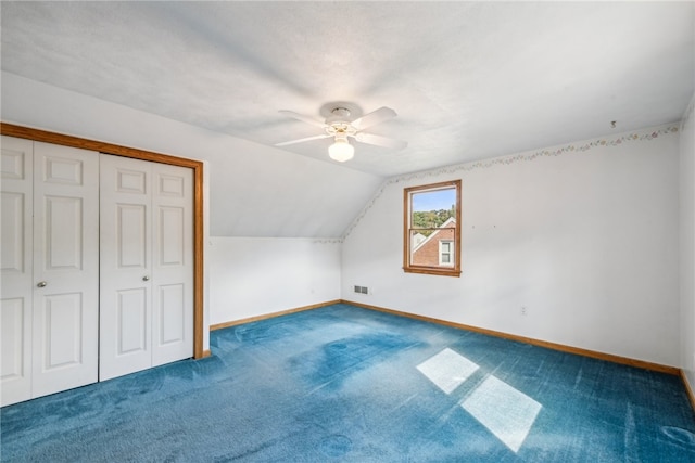 bonus room featuring ceiling fan, carpet flooring, and vaulted ceiling