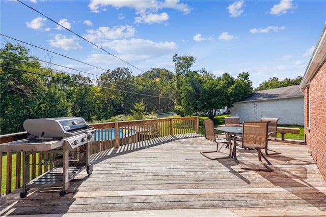 wooden terrace featuring grilling area